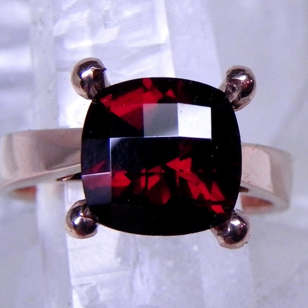 AAAA Pyrope Garnet Cushion Cut   9x9mm  3.45 Carats   in a 14K Rose gold cathedral style engagement ring.  1918