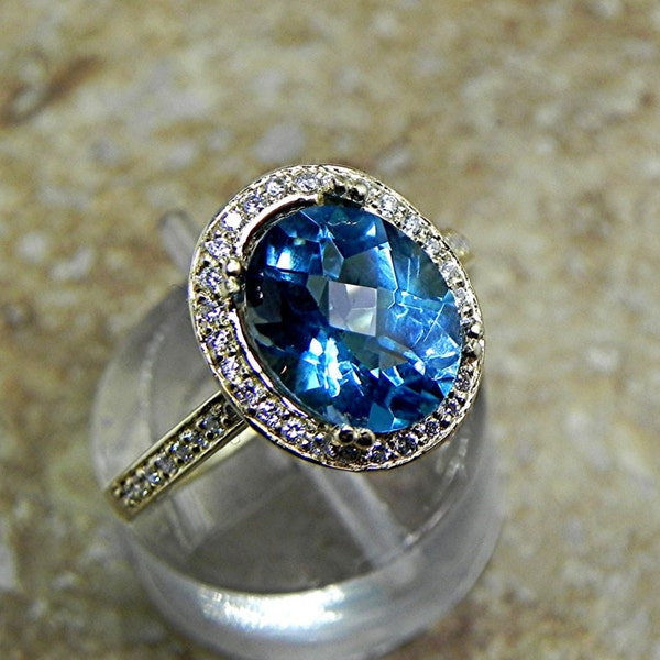 AAA London Blue Topaz   10x8mm  3.16 Carats  in a 14K Yellow gold ring with diamonds (.32ct) Ring 1815