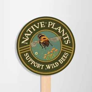 May include: A round green sign with the text "Native Plants Support Wild Bees" and a graphic of a bee pollinating flowers.