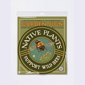 May include: A green and gold round garden sign with the text "Native Plants Support Wild Bees". A bee is illustrated in the center of the sign.