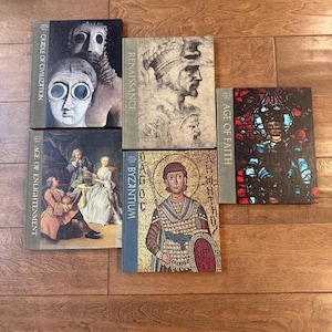 May include: A collection of hardcover books with historical art covers. Titles include "Cradle of Civilization," "Renaissance," "Age of Enlightenment," "Byzantium," and "Age of Faith." The books are arranged on a wooden surface.