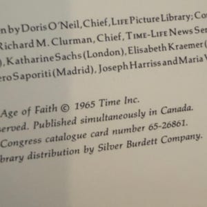May include: A close-up of a book page with text. The text includes the title "Age of Faith" and the copyright information from 1965 by Time Inc. Other text includes names and titles of people involved in the book's creation and distribution.