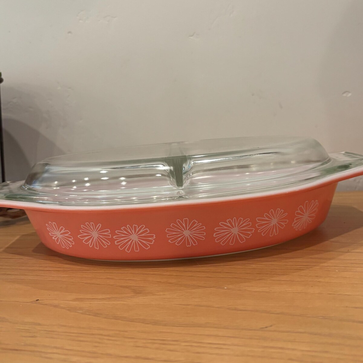 vintage Pyrex Pink Daisy Divided Casserole Dish with a clear lid