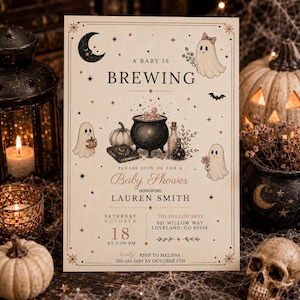 May include: A rectangular baby shower invitation card with a cream background featuring a black cauldron, pumpkins, ghosts, and stars. The text reads A BABY IS BREWING, PLEASE JOIN US FOR A BABY SHOWER HONORING LAUREN SMITH, SATURDAY OCTOBER 18 AT 1:00 PM.