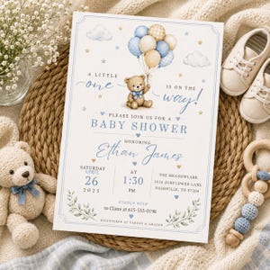 Watercolor baby boy shower invitation featuring a teddy bear holding blue and beige balloons, soft clouds, stars, hearts, and delicate greenery. Elegant baby shower invitation with blue and neutral tones, perfect for baby boy showers, teddy bear baby shower themes, little one on the way celebrations, baby sprinkles, newborn welcome parties, classic boy baby shower events, and editable printable invitation templates.