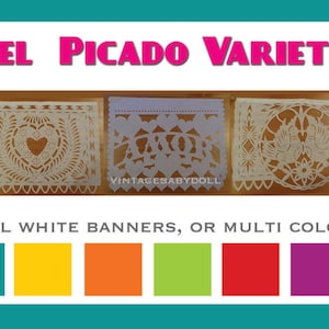May include: White paper banners with intricate cut-out designs. The text "AMOR PAPEL PICADO VARIETY BANNER" is displayed at the top. Below, the text reads "CHOOSE ALL WHITE BANNERS, OR MULTI COLORS:" with color options.