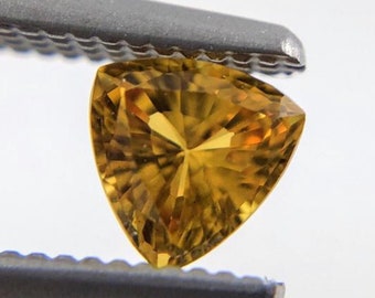 Golden yellow sapphire trillion cut 0.29 carat loose gemstone