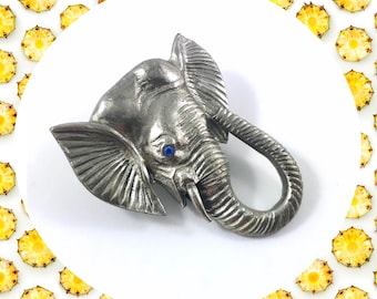 Vintage aged movable trunk blue crystal eyed elephant silver metal brooch