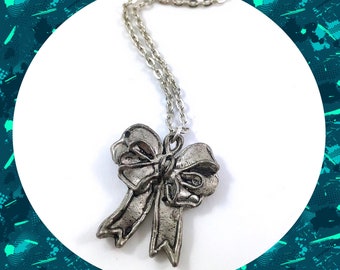 Aged antiqued silver bow ribbon pendant necklace