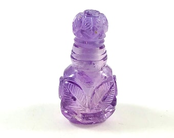 Amethyst carved miniature perfume bottle with lid that opens 23.01 carats