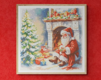 Santa Claus in front of a Fireplace with Christmas tree and gift boxes. Watercolor style. Counted Cross Stitch PDF Pattern. Hand Embroidery.