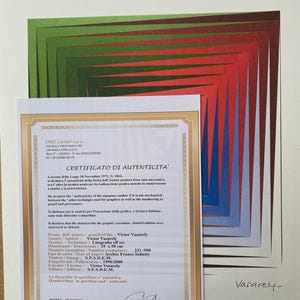 May include: A certificate of authenticity for a lithograph by Victor Vasarely. The certificate is printed on white paper with a gold border and features the artist's signature. The lithograph is titled "Litografia" and is 35 x 50 cm in size. It is numbered 231/500 and was printed in France.