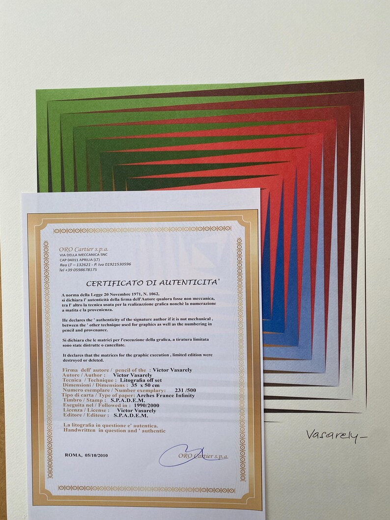 May include: A certificate of authenticity for a lithograph by Victor Vasarely. The certificate is printed on white paper with a gold border and features the artist's signature. The lithograph is titled "Litografia" and is 35 x 50 cm in size. It is numbered 231/500 and was printed in France.