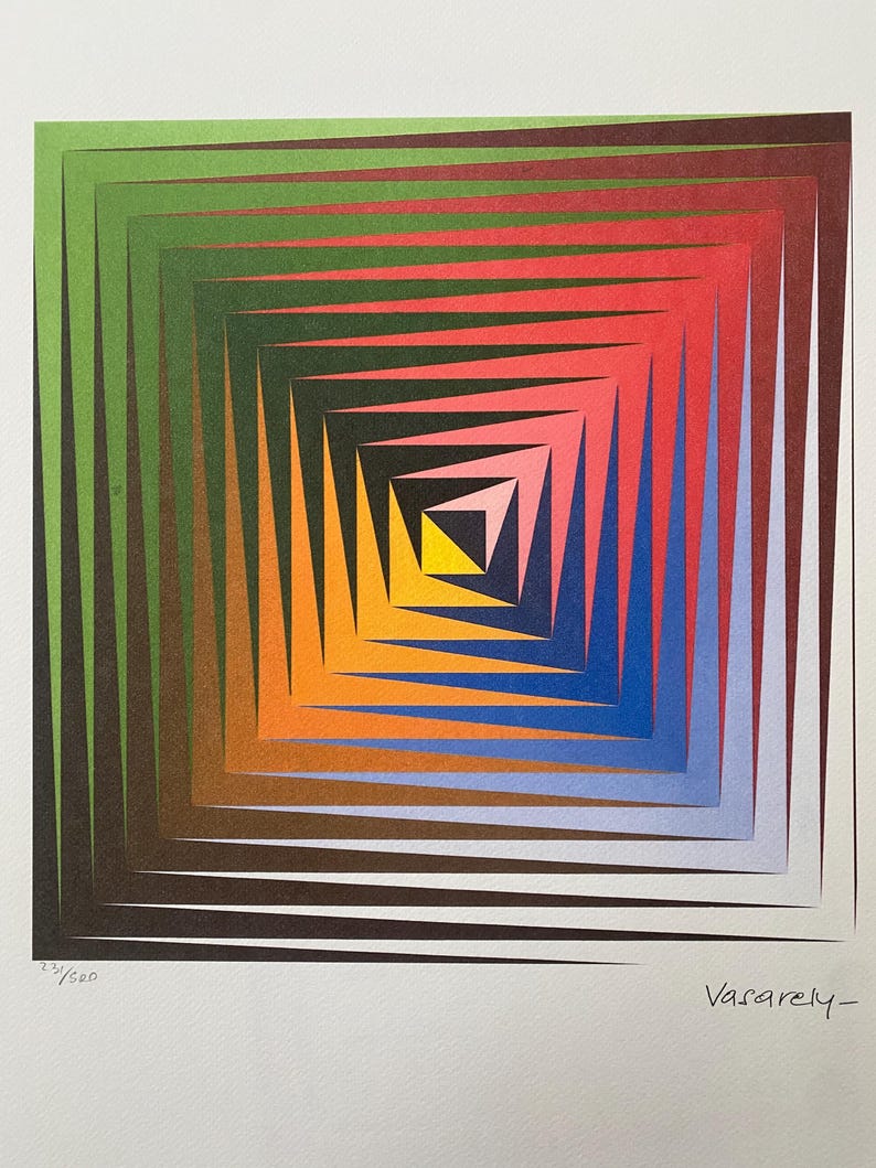 May include: A colorful abstract print with a square design featuring concentric squares in shades of green, red, orange, blue, and yellow. The print is signed "Vasarely" in the bottom right corner and numbered "23/500" in the bottom left corner.