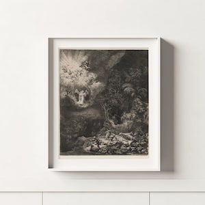 Op de afbeelding: Een ingelijste zwart-wit print van een klassiek kunstwerk. De print toont een dramatische scène met een engel in helder licht, omringd door figuren en een donker, bebost landschap. Het kunstwerk is ingelijst in een witte lijst.