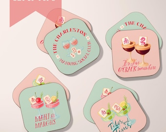 May include: A set of square coasters with rounded corners, featuring cocktail and Mahjong-themed designs. The coasters have a two-tone color scheme of pink and teal. Text includes "The Charleston Mahjong Social Club" and cocktail-related phrases.