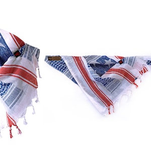 May include: A white, red, and blue patterned bandana with a star design. The bandana is made of cotton and has a fringed edge.