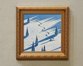 Puede incluir: Pintura enmarcada de una escena de montaña nevada con un esquiador en rojo. La obra presenta un cielo azul, suelo cubierto de nieve y altos árboles de hoja perenne que proyectan largas sombras. El marco es dorado con detalles ornamentados.