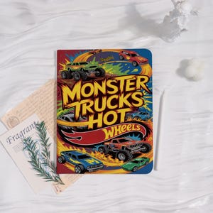 May include: A colorful notebook featuring a Hot Wheels design with monster trucks and the text "Monster Trucks Hot Wheels." The cover has a vibrant design with various toy cars and a checkered flag.