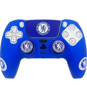 May include: A blue PlayStation 5 controller featuring Chelsea Football Club branding. The controller has the team's logo on the touchpad and buttons, with additional logos on the handles. The buttons are silver and the controller is a vibrant blue.