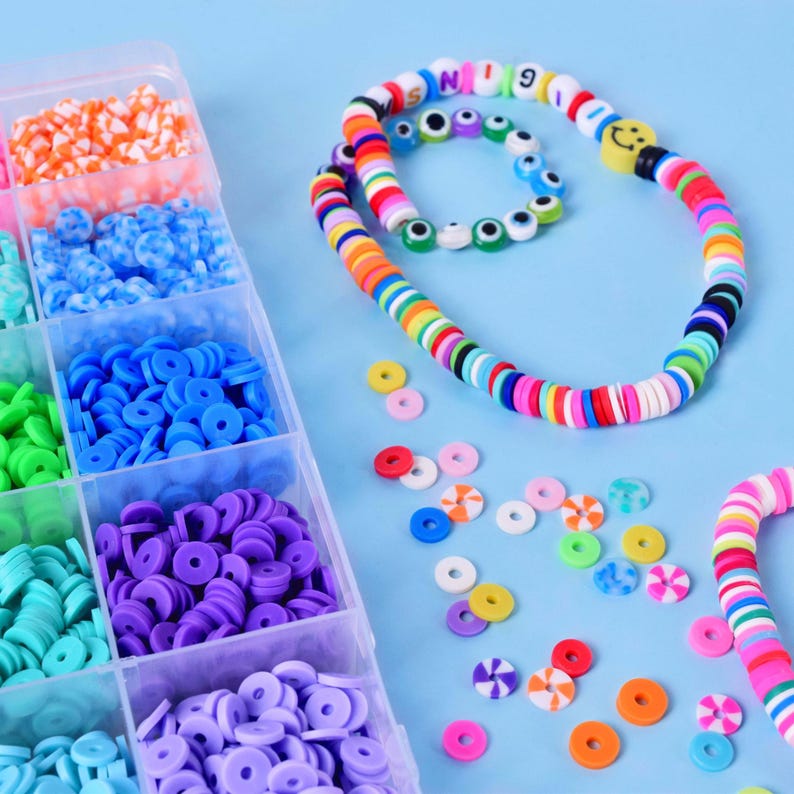 DIY bracelet making kit for girls, includes colourful flat clay beads & charms. Fun jewellery craft friendship bracelet making set for kids ages 6-12.