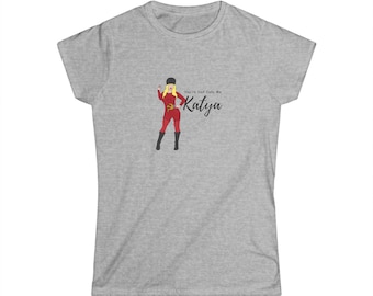 May include: A heather gray short-sleeve t-shirt featuring a graphic of a blonde figure in a red outfit and black boots holding a trident. The text "You're Dad Calls Me Katya" is printed in black script next to the figure on the front of the shirt.