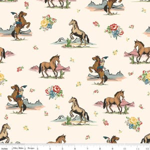 May include: Cream-coloured fabric with a repeating pattern of horses, cowboys, cacti, mountains, and floral bouquets. The horses are shown in different poses, including rearing up. The design has a vintage, Western aesthetic.