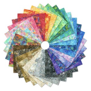 May include: A collection of 24 fabric squares featuring a colorful, abstract pattern of circles and dots. The squares are arranged in a fan shape, with the colors transitioning from yellow to red to blue.
