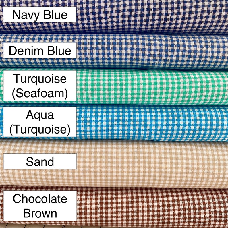 May include: Six rolls of gingham fabric in various colors, including navy blue, denim blue, turquoise, aqua, sand, and chocolate brown.