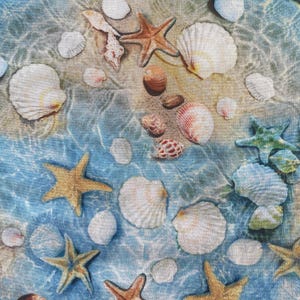 May include: A fabric design featuring a beach scene with seashells and starfish. The image shows various seashells in white, pink, and brown, along with several starfish in shades of tan and green, scattered across a sandy and watery background.
