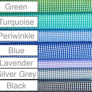 May include: A stack of seven fabric rolls with gingham patterns in different colors, including green, turquoise, periwinkle, blue, lavender, silver grey, and black.