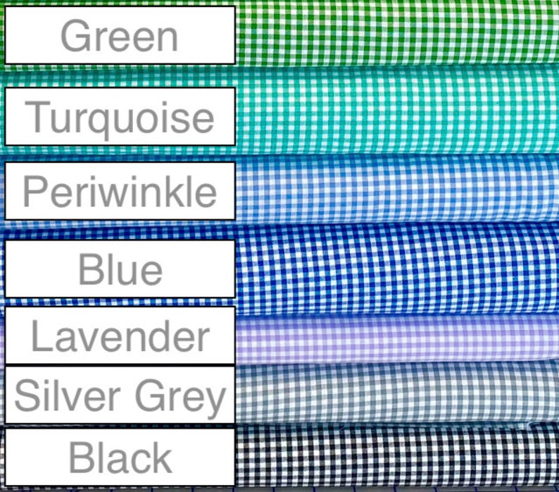 May include: A stack of seven fabric rolls with gingham patterns in different colors, including green, turquoise, periwinkle, blue, lavender, silver grey, and black.