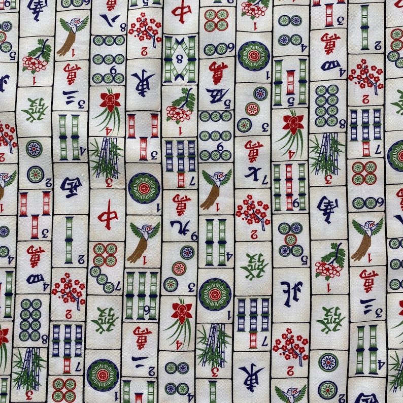 May include: Off-white fabric with a repeating pattern of colorful Mahjong tiles. The tiles feature Chinese characters, bamboo, flowers, and circles in red, green, and blue. A decorative textile.
