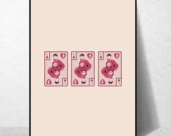 May include: Three playing cards with a red heart suit and a king face card. Each card features a man wearing a red sweatshirt with a white graphic and a white baseball cap. The cards are on a light pink background.