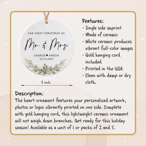 May include: A round white ceramic ornament measuring 3 inches in diameter with a gold hanging cord. The text reads OUR FIRST CHRISTMAS AS Mr & Mrs, CHARLIE AMELIA, and 12.15.2025, accompanied by a printed botanical illustration of green leaves.