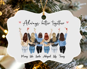 May include: A white, scalloped-edge ornament featuring an illustration of six friends with their arms around each other, holding drinks. The text reads Always better together, with the names Mary, Isla, Linda, Abigail, Lily, and Tracy printed below.