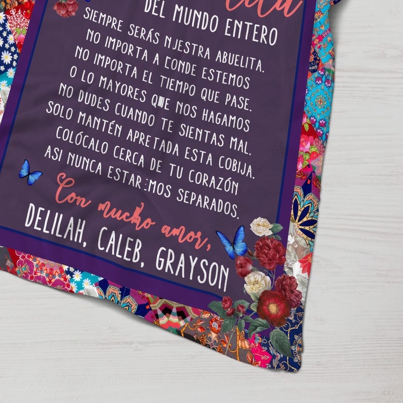 May include: Purple and floral patterned blanket with a Spanish language message that reads "DEL MUNDO ENTERO SIEMPRE SER&Aacute;S NJESTRA ABUELITA. NO IMPORTA A CONDE ESTEMOS NO IMPORTA EL TIEMPO QUE PASE. O LO MAYORES QUE NOS HAGAMOS NO DUDES CUANDO TE SIENTAS MAL. SOLO MANT&Eacute;N APRETADA ESTA COBIJA. COL&Oacute;CALO CERCA DE TU CORAZ&Oacute;N ASI NUNCA ESTAREMOS SEPARADOS. Con mucho amor, DELILAH, CALEB, GRAYSON"
