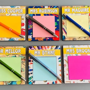 May include: Six rectangular wooden memo boards with personalised name labels at the top, including Miss Cooper, Mrs Robinson, Mr Maguire, Dr Mellor, Mr Byrne, and Mrs Brooks. Each board features a square sticky note and a matching coloured ballpoint pen.