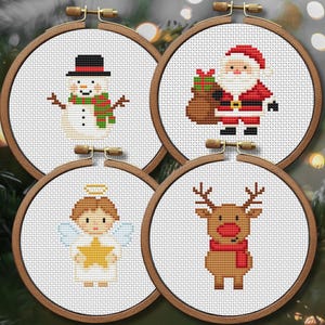 May include: Four cross-stitch embroidery hoops featuring festive Christmas designs. The designs include a snowman, Santa Claus, an angel, and a reindeer. Each design is framed in a wooden hoop, perfect for holiday decor.