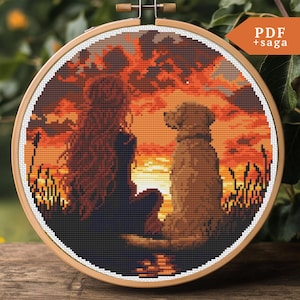 Peut inclure: Motif de point de croix représentant une femme et un chien assis ensemble devant un coucher de soleil. La femme a de longs cheveux roux et porte une robe sombre. Le chien est brun et a la tête inclinée sur le côté. Le coucher de soleil est d'un orange et d'un jaune vifs.