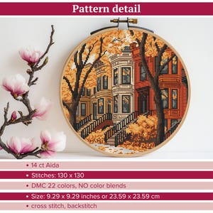 May include: Cross stitch pattern of a row of houses with autumn leaves in a circular hoop. The pattern is 130 stitches by 130 stitches and uses 22 DMC colours. The finished size is 9.29 inches by 9.29 inches.