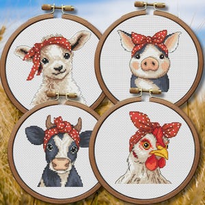 May include: Four cross-stitch embroidery hoops featuring farm animals: a lamb, pig, cow, and chicken. Each animal wears a red polka-dot bandana. The hoops are set against a background of wheat.