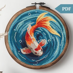 May include: Cross stitch pattern featuring a colorful koi fish swimming in a blue and white swirling water design.