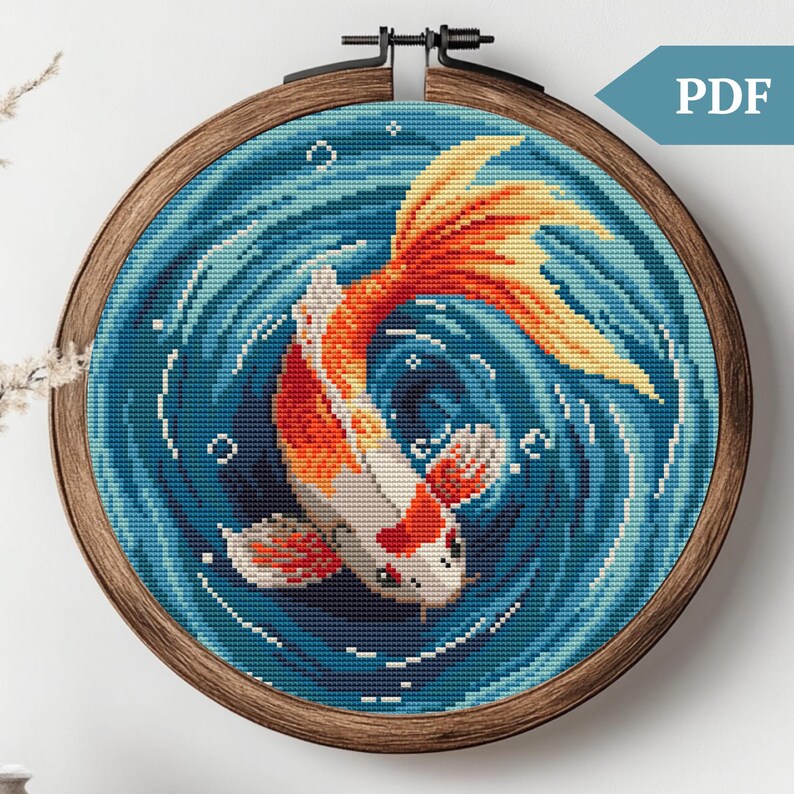 May include: Cross stitch pattern featuring a colorful koi fish swimming in a blue and white swirling water design.