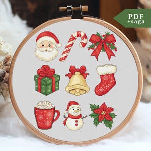 May include: A set of 10 Christmas cross-stitch patterns featuring Santa Claus, a candy cane, a bow, a gift box, a bell, a stocking, a mug of hot chocolate, a snowman, and a poinsettia.