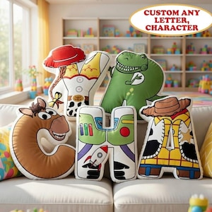 May include: Custom letter-shaped pillows featuring cartoon characters. The pillows are in the shape of the letters C, H, and A, and the characters include a horse, a dinosaur, and a cowboy. The pillows are on a white couch. Text on the image says "CUSTOM ANY LETTER, CHARACTER".