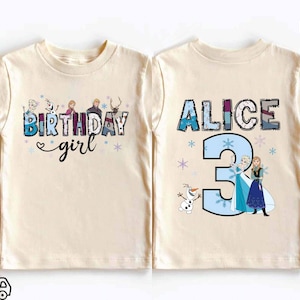 May include: A natural-colored t-shirt featuring the text BIRTHDAY girl with cartoon characters and snowflakes. A second natural-colored t-shirt displays the name ALICE, the number 3, and cartoon characters including Elsa, Anna, and Olaf with snowflakes.