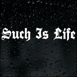 May include: White gothic font text on a black background reads "Such Is Life". The background features a pattern of water droplets, giving a textured appearance. The overall aesthetic is dark and atmospheric.