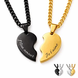 May include: Two matching heart pendant necklaces. One is black with "Mon amour" inscribed, the other gold with "Je t'aime". Both have chain necklaces. Additional options are shown below.