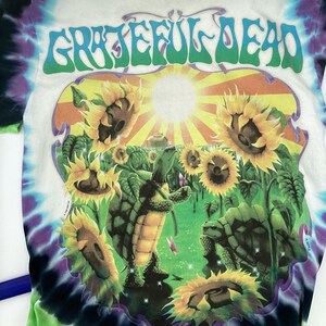 May include: A set of three ceramic mugs with a speckled, matte finish. Each mug is in a different colour: light blue, cream, and grey. The mugs have a simple, modern design with a rounded shape and a comfortable handle.